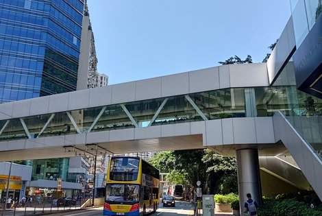 Continue under the fancy footbridge